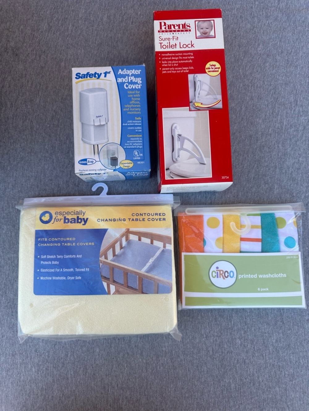 Baby/toddler 4-item lot including changing table cover, washcloths, safety items